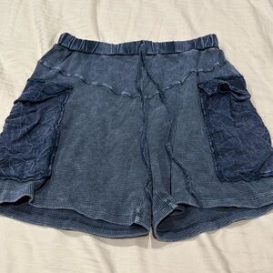 Women pull on shorts